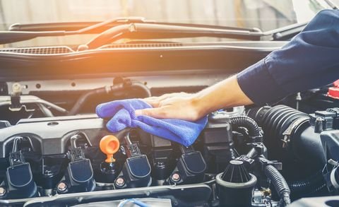 cropped of mechanic cleaning car engine royalty free image 944169048 1554929384